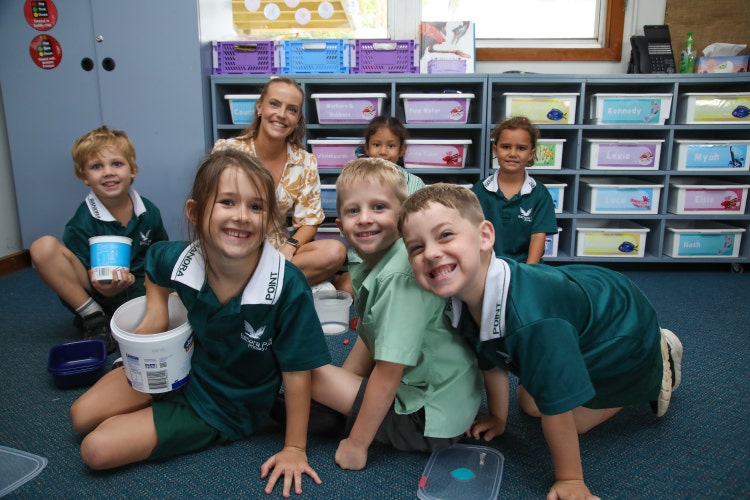 Students investigating volume and capacity using containers, guided by their classroom teacher.