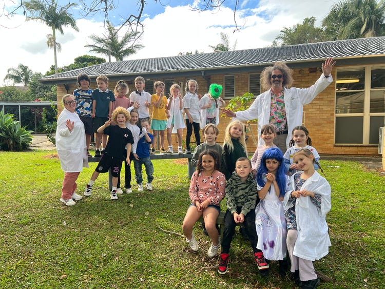 A class of students with their teacher dressed as scientists.