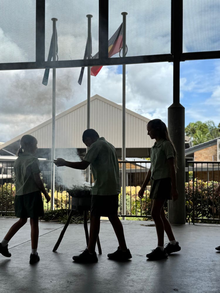 Our smoking ceremony took place in our cola area, with the 2025 leaders walking together in unison around the smoke..