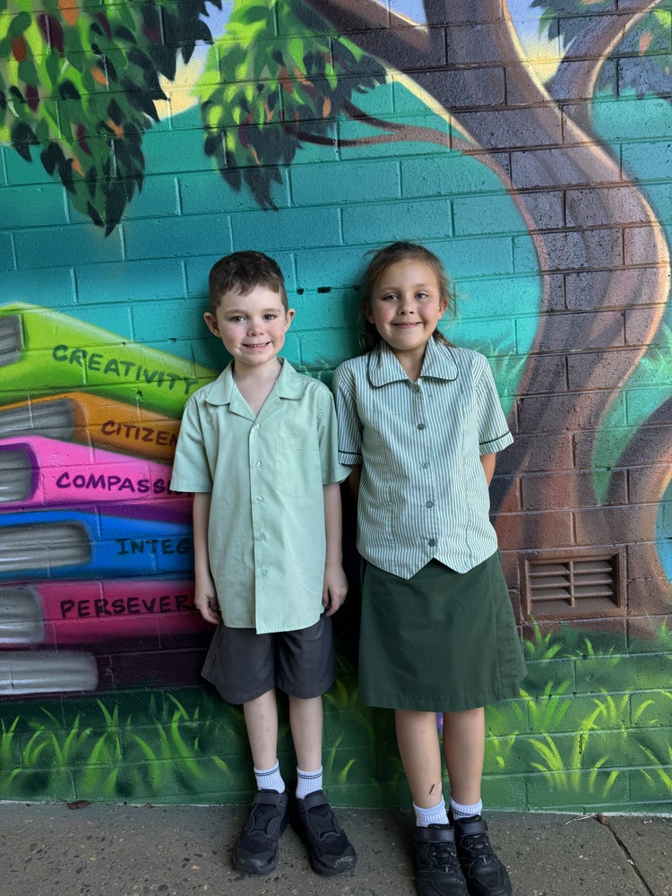 Two students wearing the summer uniform.